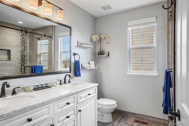 6464 Elsinore Dr, Colorado Springs, CO 80923 - bathroom featuring a sink, visible vents, and a stall shower