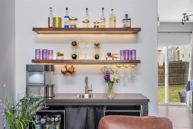 6464 Elsinore Dr, Colorado Springs, CO 80923 - bar featuring wet bar and a sink