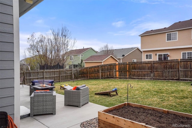 6464 Elsinore Dr, Colorado Springs, CO 80923 - view of yard with an outdoor living space with a fire pit, a fenced backyard, a vegetable garden, and a patio