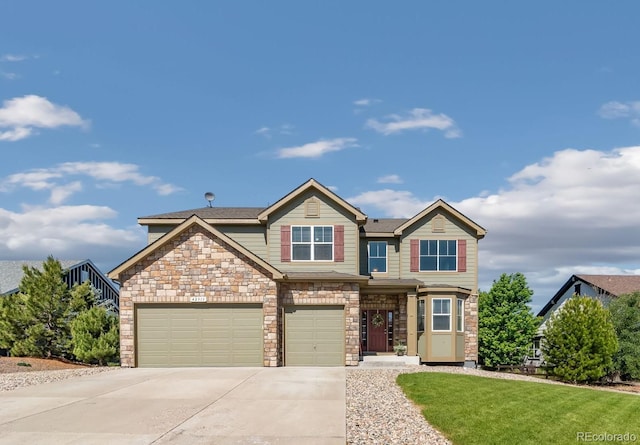 42311 Forest Oaks Dr, Elizabeth, CO 80107 - craftsman house with concrete driveway, stone siding, a front yard, and an attached garage