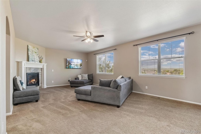 42311 Forest Oaks Dr, Elizabeth, CO 80107 - carpeted living room with ceiling fan, a fireplace, and baseboards