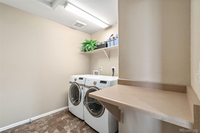 42311 Forest Oaks Dr, Elizabeth, CO 80107 - laundry room with washer and clothes dryer and baseboards