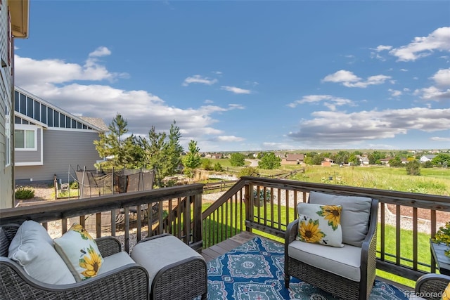 42311 Forest Oaks Dr, Elizabeth, CO 80107 - wooden deck featuring a trampoline