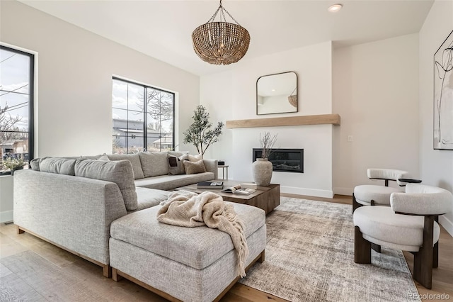 3649 W 21st Ave, Denver, CO 80211 - living area with a chandelier, wood finished floors, a glass covered fireplace, baseboards, and recessed lighting
