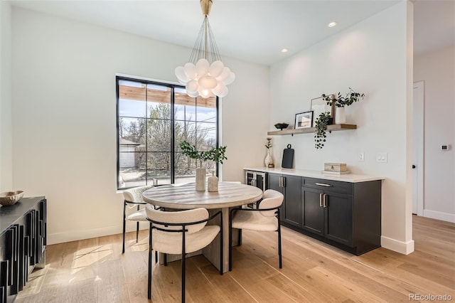 3649 W 21st Ave, Denver, CO 80211 - dining area featuring a chandelier, light wood-style floors, baseboards, bar, and recessed lighting