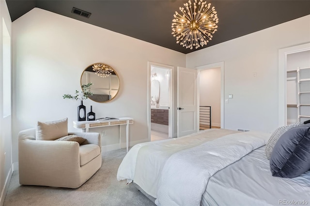 3649 W 21st Ave, Denver, CO 80211 - bedroom featuring carpet, a walk in closet, baseboards, a chandelier, and ensuite bathroom