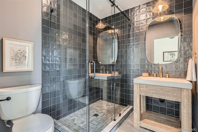3649 W 21st Ave, Denver, CO 80211 - bathroom with a stall shower, toilet, tile walls, and vanity