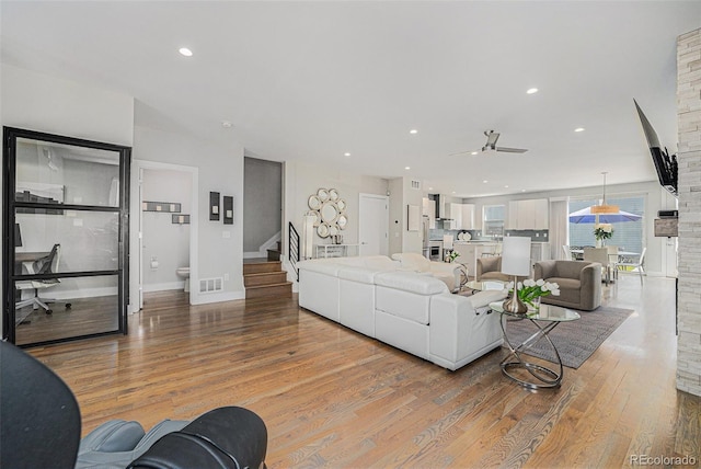 4102 Quivas St, Denver, CO 80211 - living room with a ceiling fan, wood finished floors, stairs, and recessed lighting