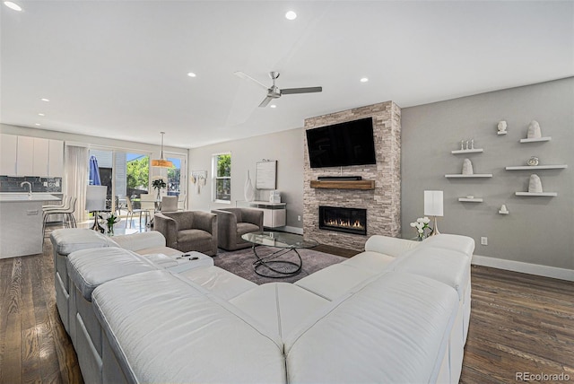 4102 Quivas St, Denver, CO 80211 - living area with dark wood-type flooring, ceiling fan, a fireplace, and recessed lighting