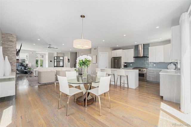 4102 Quivas St, Denver, CO 80211 - dining area featuring a ceiling fan, light wood-type flooring, and recessed lighting
