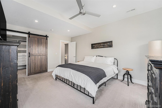 4102 Quivas St, Denver, CO 80211 - bedroom featuring light colored carpet, a barn door, recessed lighting, and ceiling fan