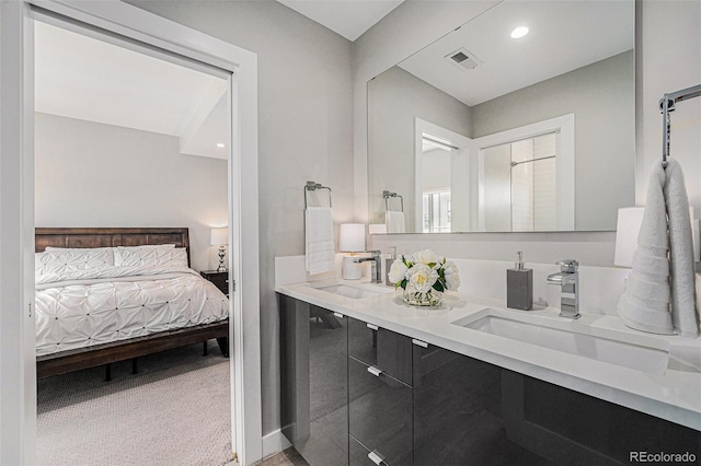 4102 Quivas St, Denver, CO 80211 - full bath with connected bathroom, double vanity, and recessed lighting
