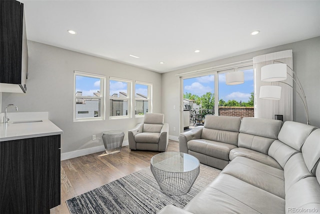 4102 Quivas St, Denver, CO 80211 - living area featuring light wood-style floors and recessed lighting