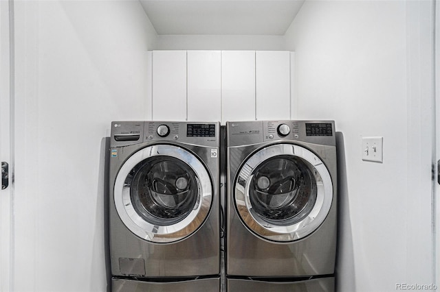 4102 Quivas St, Denver, CO 80211 - laundry area with washing machine and clothes dryer and cabinet space