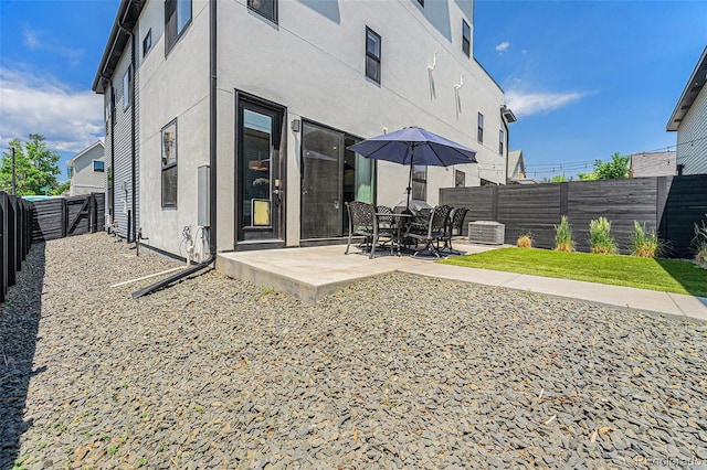 4102 Quivas St, Denver, CO 80211 - rear view of property with a patio area, a fenced backyard, and stucco siding
