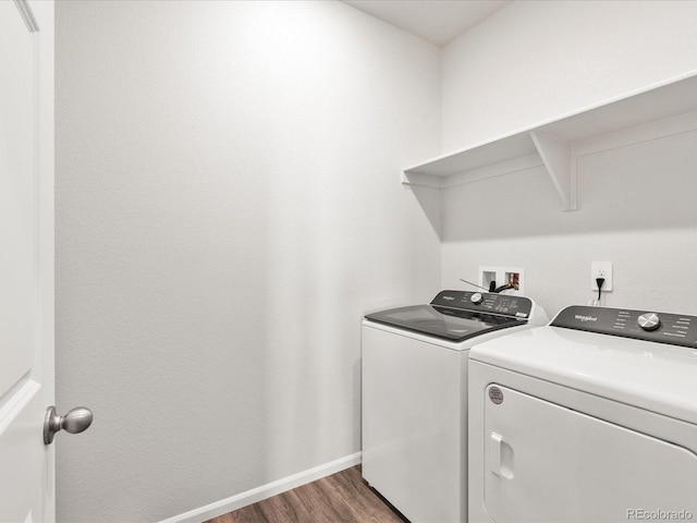 9069 Pitkin St, Commerce City, CO 80022 - washroom with washer and clothes dryer, wood finished floors, and baseboards