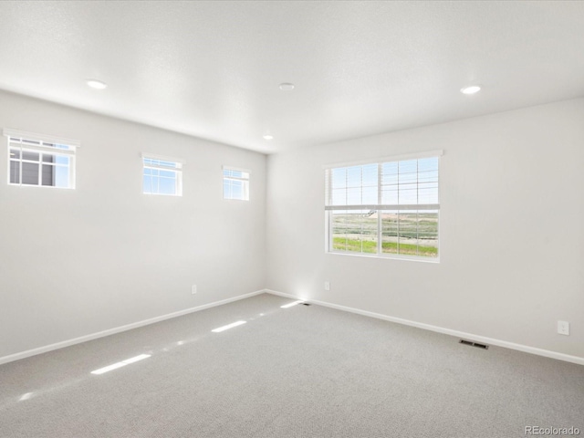 9069 Pitkin St, Commerce City, CO 80022 - spare room with carpet, baseboards, and recessed lighting