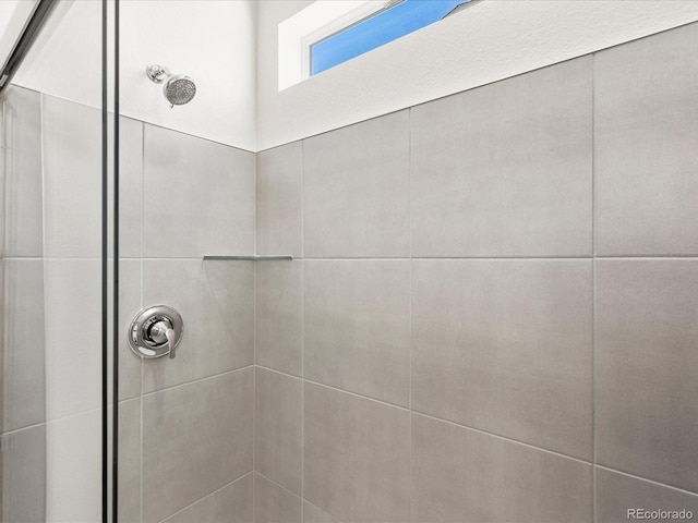 9069 Pitkin St, Commerce City, CO 80022 - full bathroom featuring a tile shower