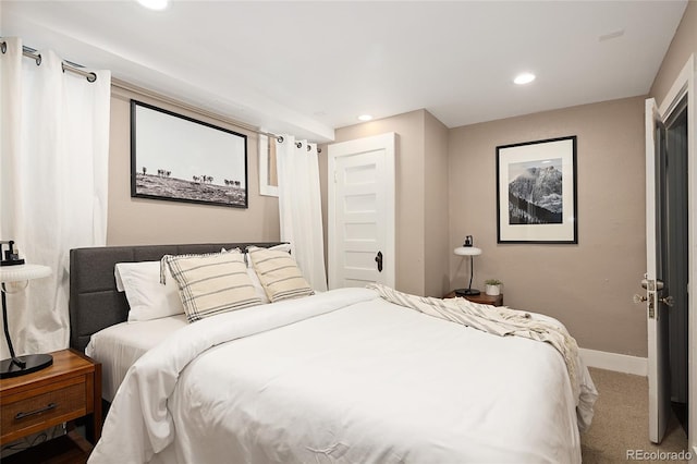 bedroom with baseboards, recessed lighting, and carpet