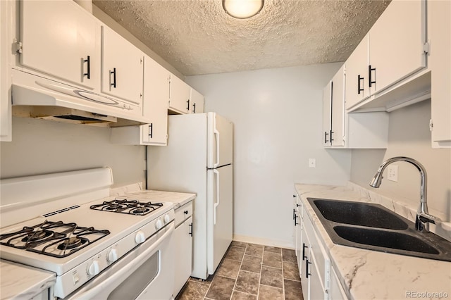 kitchen with a textured ceiling, sink, white cabinets, and white appliances