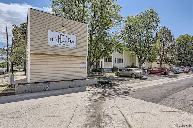 10712 E Exposition Ave Unit 209, Aurora, CO 80012 - view of property with uncovered parking