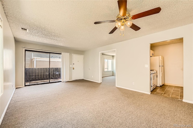 10712 E Exposition Ave Unit 209, Aurora, CO 80012 - unfurnished room featuring carpet, a ceiling fan, a textured ceiling, and baseboards