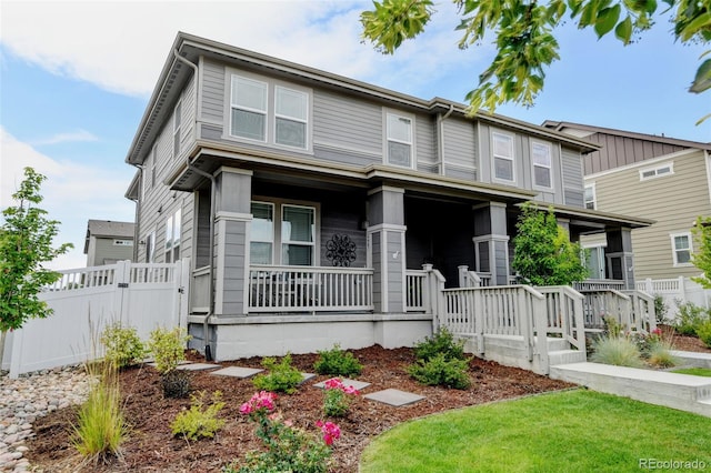 2463 Alpine St, Longmont, CO 80504 - traditional home featuring a porch and a gate