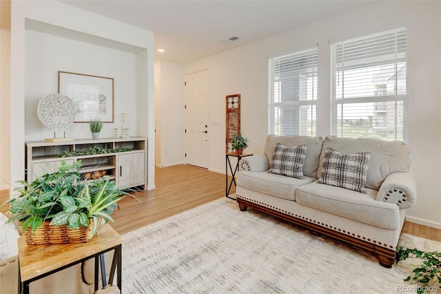 2463 Alpine St, Longmont, CO 80504 - living area with wood finished floors and recessed lighting