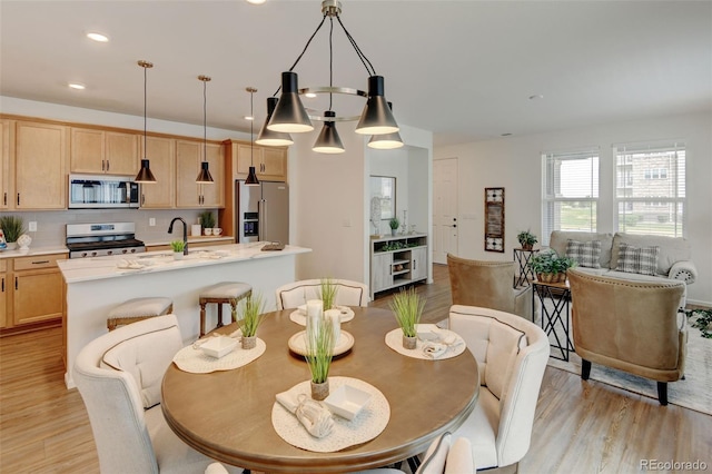 2463 Alpine St, Longmont, CO 80504 - dining space with light wood-type flooring and recessed lighting