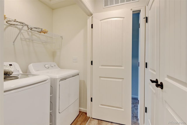 2463 Alpine St, Longmont, CO 80504 - laundry area featuring washing machine and clothes dryer and light wood-style flooring