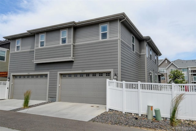 2463 Alpine St, Longmont, CO 80504 - view of front of property featuring an attached garage and driveway