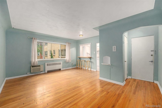 665 Washington St Unit 5B, Denver, CO 80203 - unfurnished living room with radiator and wood-type flooring