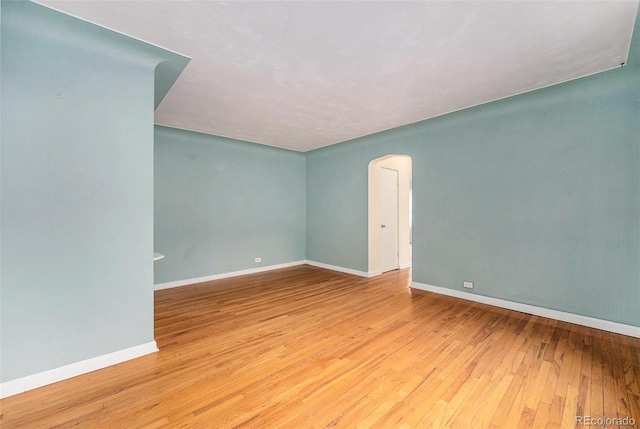 665 Washington St Unit 5B, Denver, CO 80203 - empty room with wood-type flooring and arched walkways