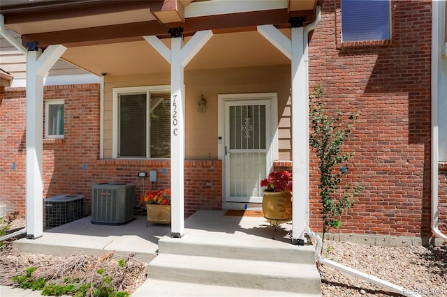 7520 W Coal Mine Ave Unit C, Littleton, CO 80123 - entrance to property with brick siding and covered porch