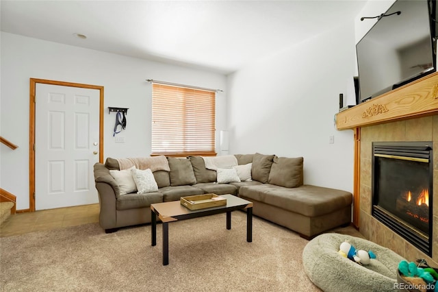 7520 W Coal Mine Ave Unit C, Littleton, CO 80123 - living room with a tile fireplace, light colored carpet, light tile patterned floors, and stairway