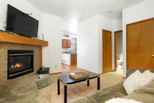 7520 W Coal Mine Ave Unit C, Littleton, CO 80123 - living area with light colored carpet and a tile fireplace