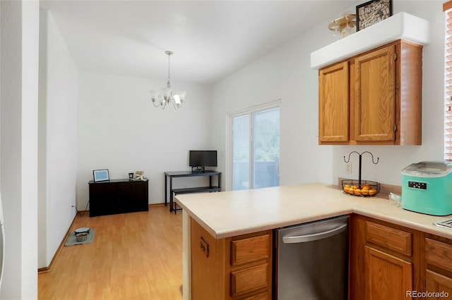 7520 W Coal Mine Ave Unit C, Littleton, CO 80123 - kitchen with light wood-type flooring, stainless steel dishwasher, a chandelier, a peninsula, and light countertops