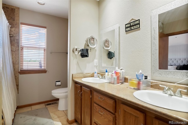7520 W Coal Mine Ave Unit C, Littleton, CO 80123 - ensuite bathroom with double vanity, tile patterned flooring, and a shower with shower curtain