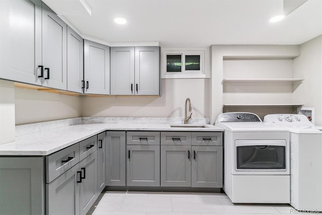 6330 E Vassar Ave, Denver, CO 80222 - laundry room featuring cabinet space, separate washer and dryer, light tile patterned flooring, and recessed lighting