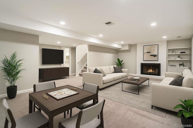 6330 E Vassar Ave, Denver, CO 80222 - living area with light colored carpet, recessed lighting, stairs, a large fireplace, and built in features