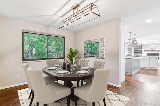 6330 E Vassar Ave, Denver, CO 80222 - dining space featuring wood finished floors and baseboards