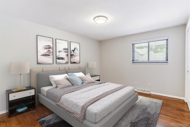 6330 E Vassar Ave, Denver, CO 80222 - bedroom with baseboards and wood finished floors