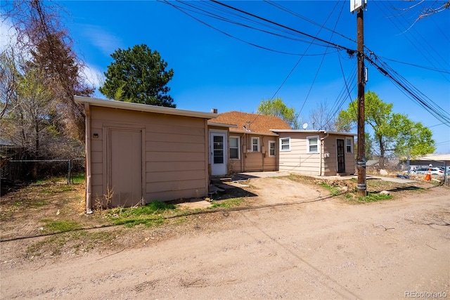 view of front of property featuring fence