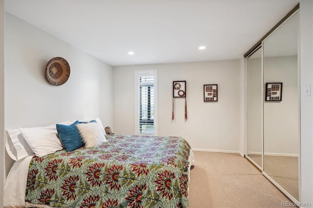 carpeted bedroom featuring a closet