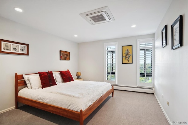 carpeted bedroom featuring a baseboard radiator