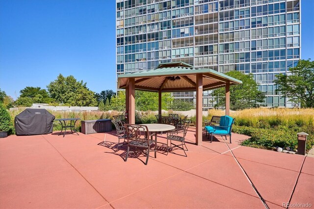 view of patio / terrace with area for grilling and a gazebo