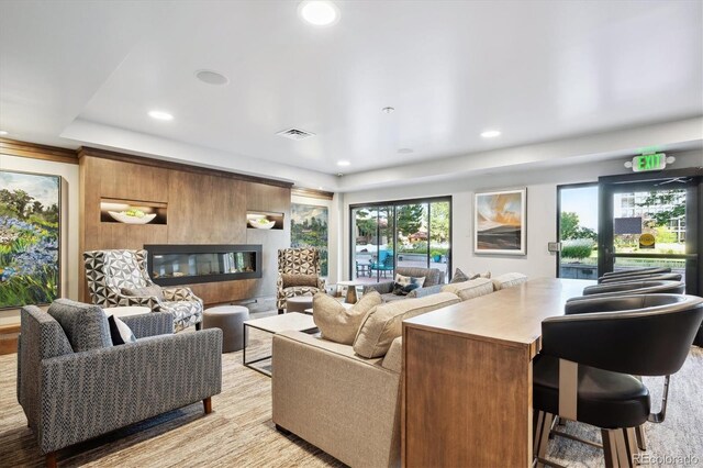 living room featuring light hardwood / wood-style flooring and plenty of natural light