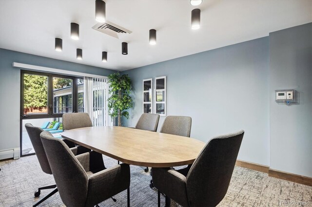 dining room with light hardwood / wood-style floors