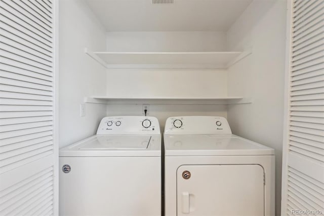 laundry area featuring washing machine and dryer