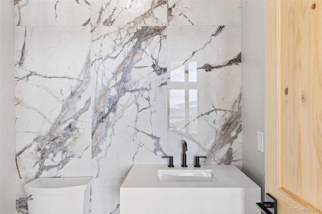 bathroom featuring sink and toilet